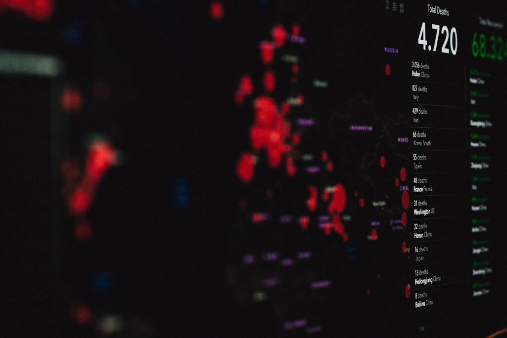 pexels-photo-3970329-3970329 Data visualization screen showing COVID-19 pandemic statistics and geographic spread.
